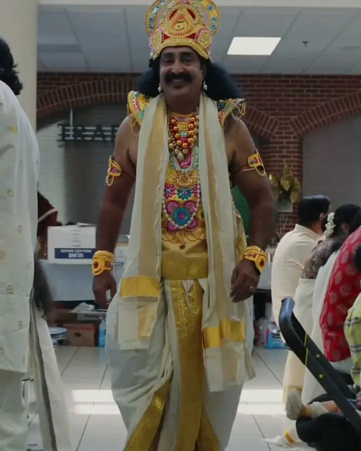 Maveli in costume greeting guests at AMMA Onam 2026