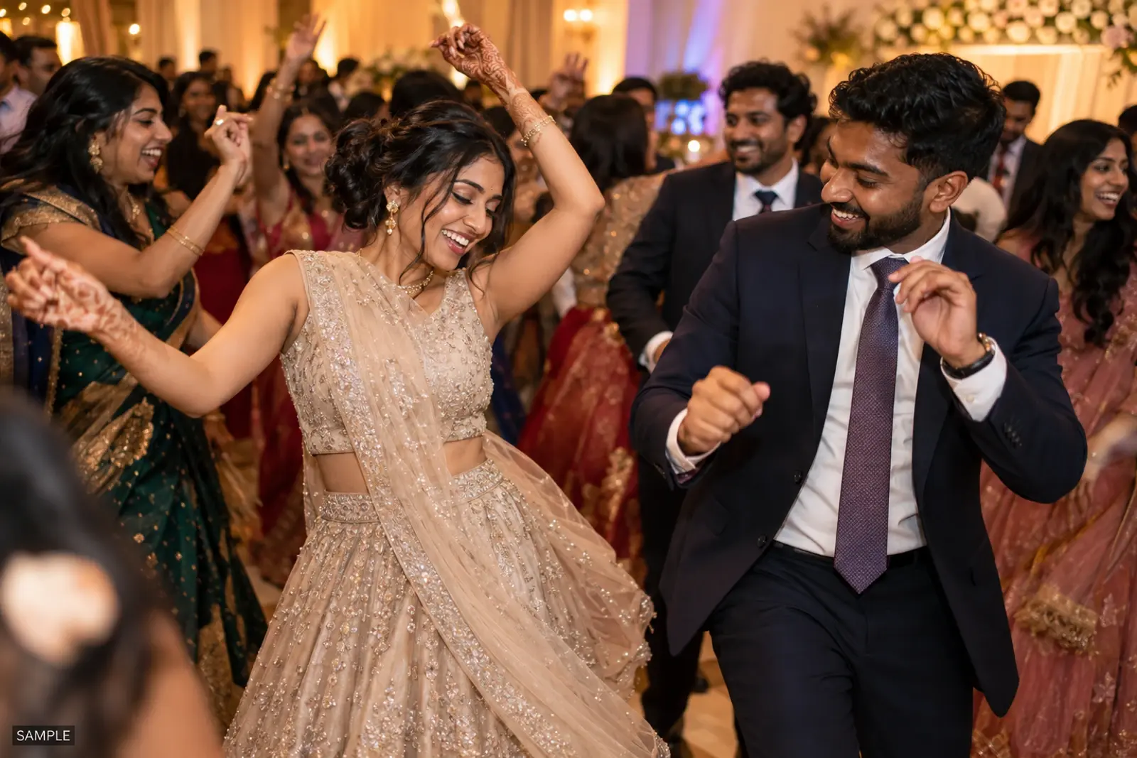 Guests dancing under warm string lights at a reception